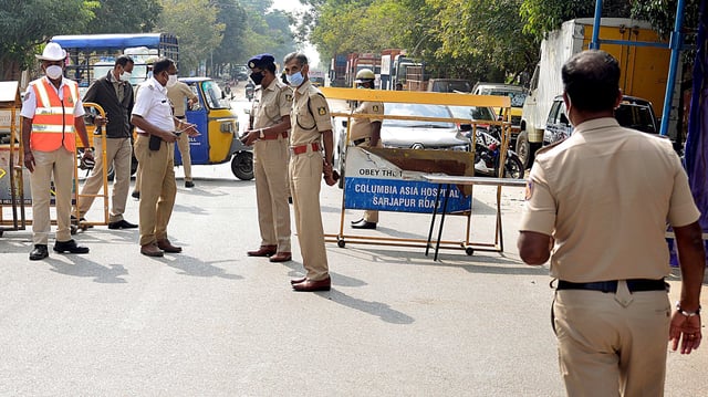 Karnataka Police stand guard at a checkpoint during weekend curfew in Bengaluru, on 8 January 2022 | ANI Photo