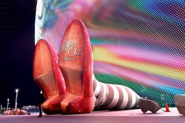 A display of 50-foot-long legs and 22-foot-tall ruby slippers, a promotion for the upcoming "Wizard of Oz at Sphere" movie, in Las Vegas, Nevada, U.S., August 20, 2025.  REUTERS/Steve Marcus/File Photo