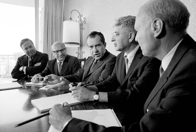 Presidential nominee Richard Nixon poses with a team of economic advisers in San Diego on August 14, 1968, where Nixon and his staff are outlining their full campaign. From left to right: Pierre A. Rinfret, Milton Friedman, Nixon, Arthur Burns and Don Perlberg.