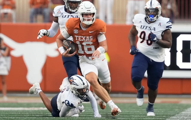 Texas quarterback Arch Manning (16) breaks away from defenders for a touchdown run during the first half against Texas-San Antonio at Darrell K Royal-Texas Memorial Stadium.