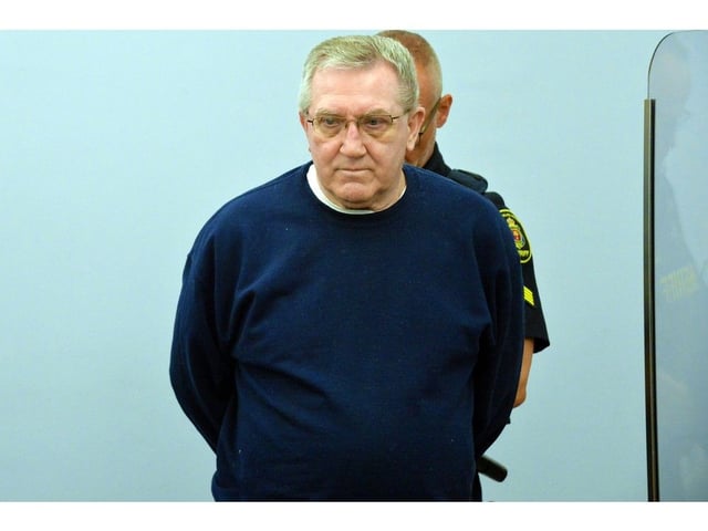 Tony Humby is led into court at the start of his trial Aug. 27, 2025.