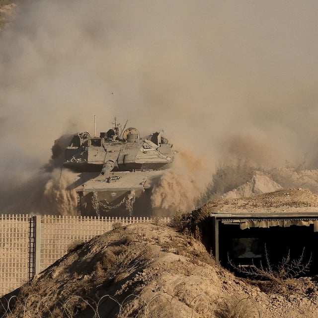An Israeli army battle tank in the Gaza Strip near the border with southern Israel on Aug. 29. Israel is preparing to widen its offensive in Gaza City.