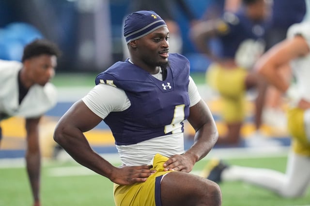 Notre Dame running back Jeremiyah Love warms up during practice July 31, 2025, in South Bend, Ind. (AP Photo/Michael Conroy)