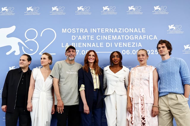 Director Luca Guadagnino, screenwriter Nora Garrett, Julia Roberts, Ayo Edebiri, Andrew Garfield, Michael Stuhlbarg and Chloe Sevigny pose during a photocall for the movie "After the Hunt" out of competition, at the 82nd Venice International Film Festival, Venice, Italy, August 29, 2025. REUTERS/Yara Nardi