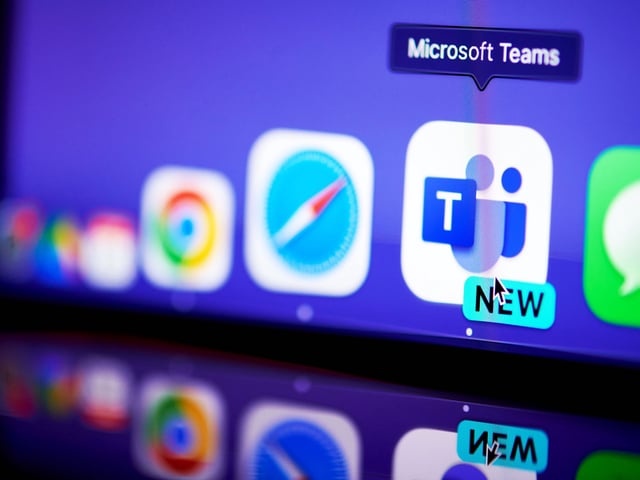 Microsoft Teams app and logo running on a laptop and smartphone.