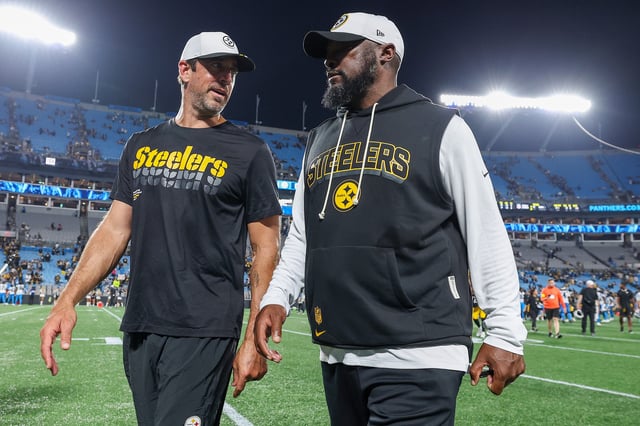 CHARLOTTE, NORTH CAROLINA - AUGUST 21: Aaron Rodgers #8 and head coach Mike Tomlin of the Pittsburgh Steelers leave the field after the NFL Preseason 2025 game between Pittsburgh Steelers and Carolina Panthers at Bank of America Stadium on August 21, 2025 in Charlotte, North Carolina. (Photo by Grant Halverson/Getty Images)