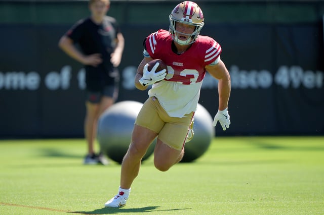 SANTA CLARA, CALIFORNIA - AUGUST 05: Christian McCaffrey #23 of the San Francisco 49ers runs with the ball in drills during practice at training camp at SAP Performance Facility on August 05, 2025 in Santa Clara, California. (Photo by Thearon W. Henderson/Getty Images)