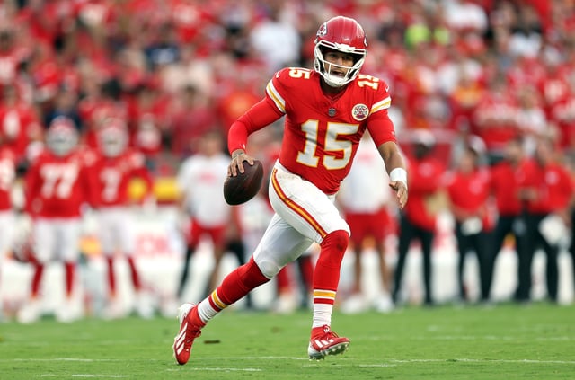 KANSAS CITY, MISSOURI - AUGUST 22: Quarterback Patrick Mahomes #15 of the Kansas City Chiefs scrambles during the first quarter of the NFL Preseason 2025 game against the Chicago Bears at Arrowhead Stadium on August 22, 2025 in Kansas City, Missouri. (Photo by Jamie Squire/Getty Images)