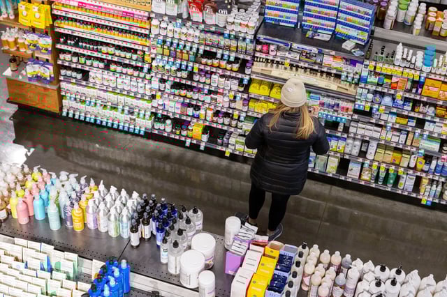 A person shops in a supermarket in Manhattan, New York City, U.S., March 28, 2022. REUTERS/Andrew Kelly/File Photo