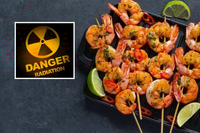 Stock photo shows cooked shrimp and hazard radiation symbol.