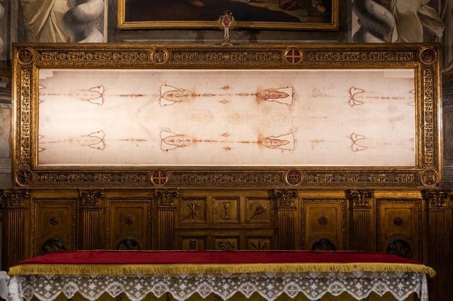 A stock image shows a copy of the Shroud of Turin displayed at San Domenico Church in Turin, Italy.