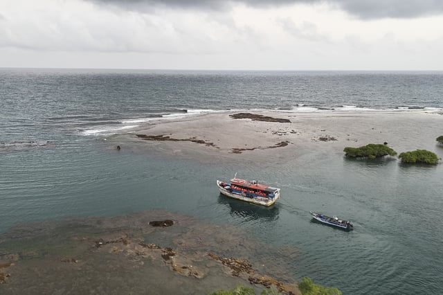 FILE - A boat transporting migrants departs the Caribbean coastal village of Miramar, Panama, for the Colombian border, Feb. 27, 2025, as migrants return from southern Mexico after abandoning hopes of reaching the U.S. in a reverse flow triggered by the Trump administration's immigration crackdown. (AP Photo/Matias Delacroix, File)