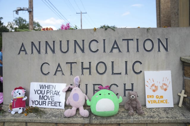 Items are left at a memorial at Annunciation Catholic Church after Wednesday's school shooting, Thursday, Aug. 28, 2025, in Minneapolis. (AP Photo/Abbie Parr)