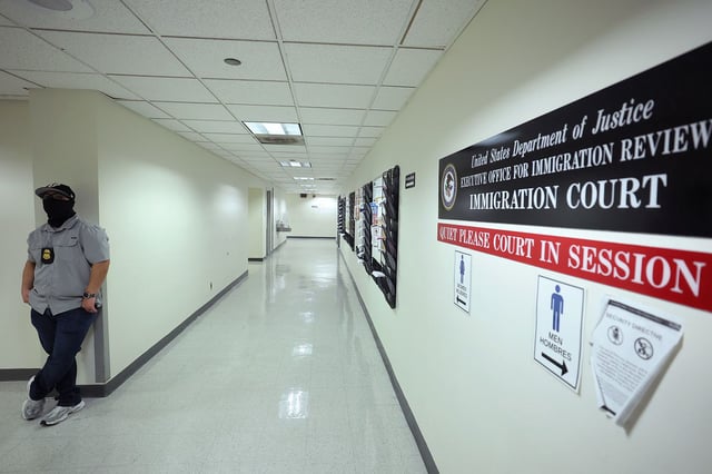  Federal agents patrol the halls of immigration court at the Jacob K. Javitz Federal Building on August 28,  in New York.