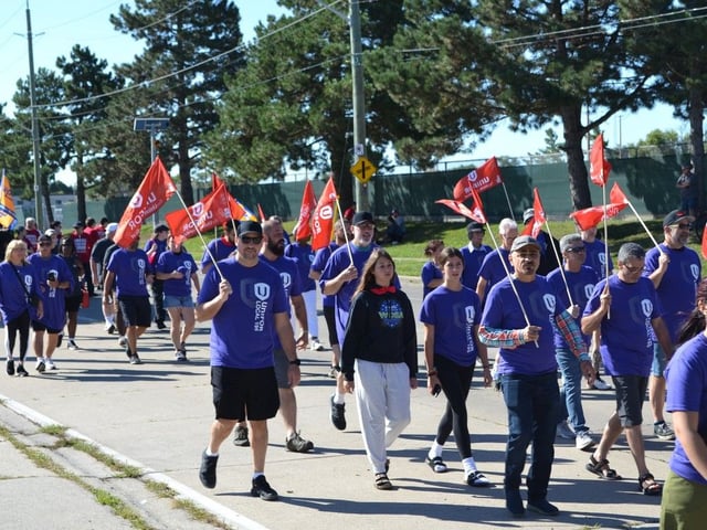  Members of the Windsor & District Labour Council march at the annual Labour Day parade in Windsor on Monday, Sept. 2, 2024. JULIE KOTSIS/Windsor Star