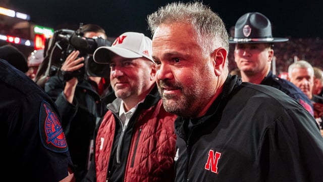 Nov 23, 2024; Lincoln, Nebraska, USA; Nebraska Cornhuskers head coach Matt Rhule and athletic director Troy Dannen walk off the field after defeating the Wisconsin Badgers at Memorial Stadium. Mandatory Credit: Dylan Widger-Imagn Images