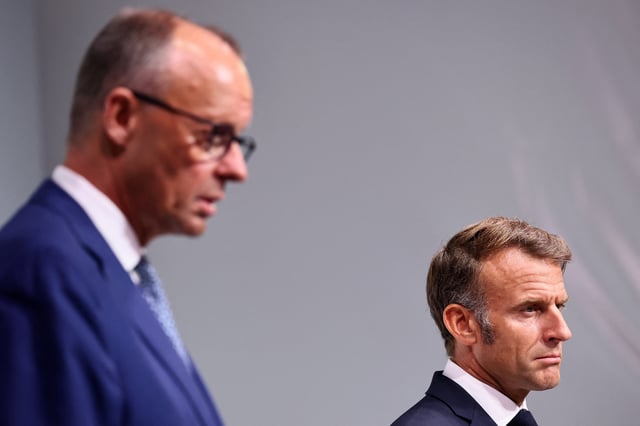 French President Emmanuel Macron and German Chancellor Friedrich Merz attend a joint news conference as part of a Franco-German cabinet meeting and a meeting of the Franco-German Defence and Security Council (CFADS) in Toulon, France, August 29, 2025. REUTERS/Manon Cruz/Pool/File Photo
