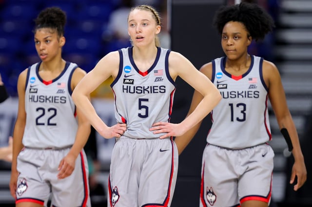 SAN ANTONIO, TEXAS - MARCH 29: Evina Westbrook #22, Paige Bueckers #5, and Christyn Williams #13 of the UConn Huskies walk down the court during the second half against the Baylor Lady Bears in the Elite Eight round of the NCAA Women's Basketball Tournament at the Alamodome on March 29, 2021 in San Antonio, Texas.