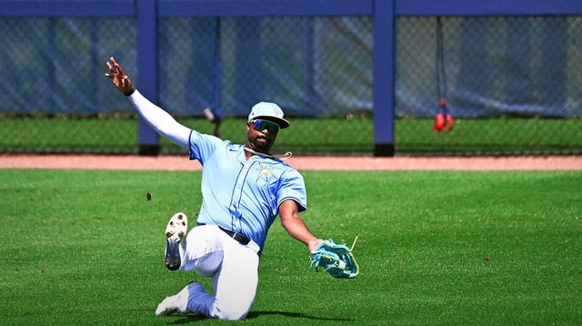 Mar 13, 2025; Port Charlotte, Florida, USA; Tampa Bays Rays left fielder Eloy Jimenez (74) catches a line drive in the third inning against the Washington Nationals during spring training at Charlotte Sports Park. Mandatory Credit: Jonathan Dyer-Imagn Images