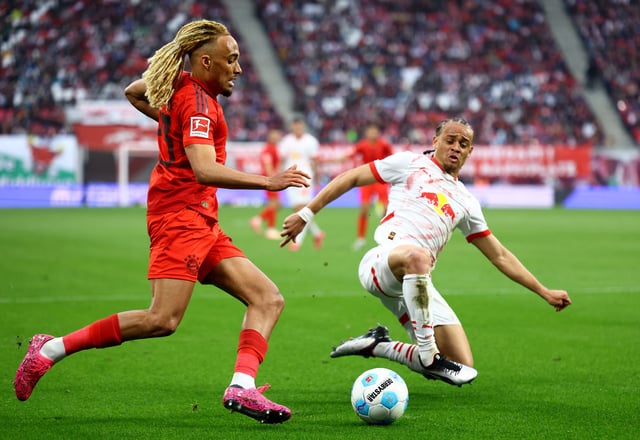 Soccer Football - Bundesliga - RB Leipzig v Bayern Munich - Red Bull Arena, Leipzig, Germany - May 3, 2025 Bayern Munich's Sacha Boey in action with RB Leipzig's Xavi Simons REUTERS/Lisi Niesner/File Photo