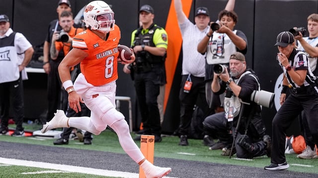 Oklahoma State quarterback Hauss Hejny (8) runs the ball for a touchdown in the first quarter during an NCAA football game between Oklahoma State (OSU) and UT Martin in Stillwater, Okla., on Thursday, Aug. 28, 2025.