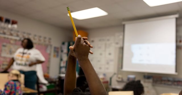 Temple, Texas  - 4/17/25: JoMeka Gray teaches a class of kindergarteners at Kennedy-Powell Elementary in Temple, Texas. Ilana Panich-Linsman for The Texas Tribune