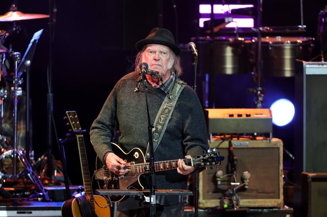 LOS ANGELES, CALIFORNIA - APRIL 26: Neil Young performs onstage during the Light Up The Blues 7 Concert celebrating Autism Speaks' 20th Anniversary at the Greek Theatre on April 26, 2025 in Los Angeles, California. (Photo by Kevin Winter/Getty Images)