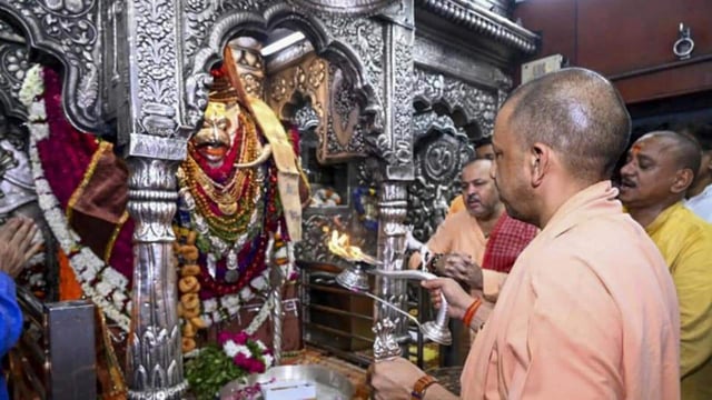 Uttar Pradesh chief minister Yogi Adityanath offering prayers at Kaal Bhairav temple in Varanasi on Friday. (PTI PHOTO)