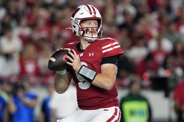 Aug 28, 2025; Madison, Wisconsin, USA;  Wisconsin Badgers quarterback Billy Edwards Jr. (9) looks to throw a pass during the second quarter against the Miami (OH) RedHawks at Camp Randall Stadium. Mandatory Credit: Jeff Hanisch-Imagn Images