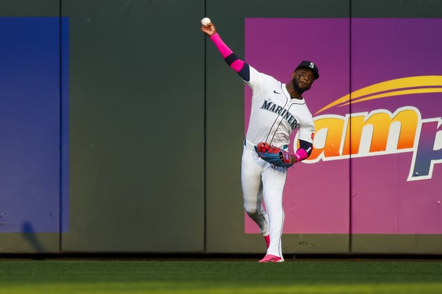 Aug 25, 2025; Seattle, Washington, USA; Seattle Mariners right fielder Victor Robles (10) throws to second base following a double by the San Diego Padres during the first inning at T-Mobile Park. Mandatory Credit: Joe Nicholson-Imagn Images/File Photo