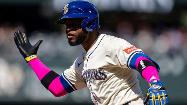 Aug 24, 2025; Seattle, Washington, USA; Seattle Mariners right fielder Victor Robles (10) celebrates at second base after hitting a two-run single during the third inning against the Athletics at T-Mobile Park. Mandatory Credit: Stephen Brashear-Imagn Images