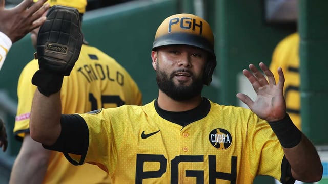 Aug 22, 2025; Pittsburgh, Pennsylvania, USA; Pittsburgh Pirates third baseman Isiah Kiner-Falefa (7) celebrates in the dugout after scoring a run against the Colorado Rockies during the second inning at PNC Park. Mandatory Credit: Charles LeClaire-Imagn Images