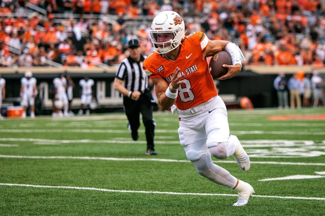 Aug 28, 2025; Stillwater, Oklahoma, USA; Oklahoma State Cowboys quarterback Hauss Hejny (8) runs the ball during the first half against the Tennessee Martin Skyhawks at Boone Pickens Stadium. Mandatory Credit: William Purnell-Imagn Images