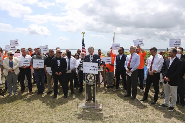Rhode Island Gov. Dan McKee talks about the importance of the Revolution Wind offshore wind farm to the state's economy and energy future during a news conference in North Kingstown, R.I., on Monday, Aug. 25, 2025. (AP Photo/Jennifer McDermott)