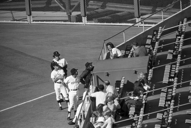 Wimbledon tennis champ, Billie Jean King, draws fans even from amongst the other pros as she attends the game between the San Francisco Giants and the San Diego Padres at Candlestick Park. Billie Jean has more than just a passing interest in the game, her brother, Randy Moffitt, is on the Giant pitching staff.