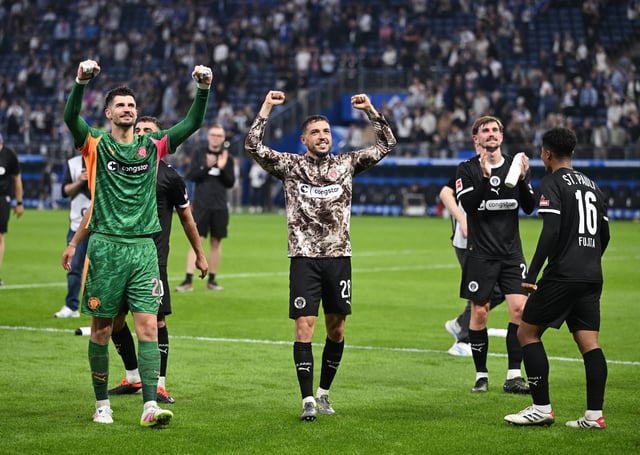 Soccer Football - Bundesliga - Hamburger SV v St. Pauli - Volksparkstadion, Hamburg, Germany - August 29, 2025 St Pauli's Nikola Vasiljev and Mathias Pereira Lage celebrate after the match REUTERS/Teresa Kroeger