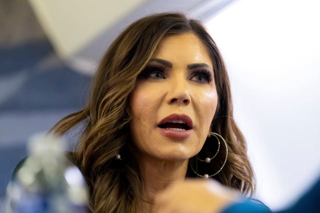 U.S. Homeland Security Secretary Kristi Noem speaks with a reporter on her plane while in the air en route from Quito, Ecuador to Joint Base Andrews, Md., Thursday, July 31, 2025.     Alex Brandon/Pool via REUTERS/File photo