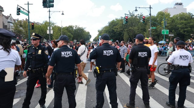 NYPD officers are pictured on Eastern Pkwy. and Franklin Ave. in Brooklyn during the West Indian Day Parade in 2024. (Luiz C. Ribeiro for New York Daily News)
