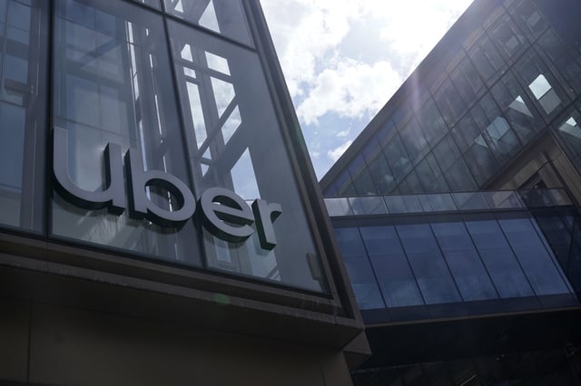 FILE - An Uber sign is displayed at the company's headquarters in San Francisco, Sept. 12, 2022. (AP Photo/Jeff Chiu, File)