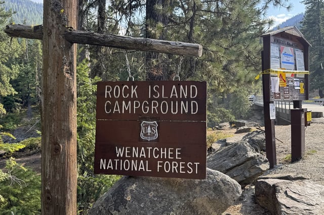 This photo provided by FBI Seattle shows the entrance to Rock Island Campground where multiple law enforcement agencies are participating in the search for Travis Decker, who was charged with murder and kidnapping, near Leavenworth, Wash. on August. 25, 2025. 