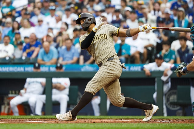Aug 26, 2025; Seattle, Washington, USA; San Diego Padres shortstop Xander Bogaerts (2) hits an RBI-single against the Seattle Mariners during the first inning at T-Mobile Park. Mandatory Credit: Joe Nicholson-Imagn Images/File Photo