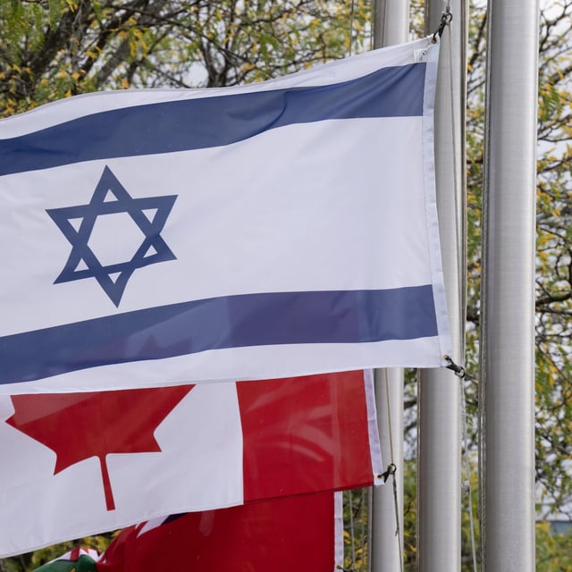 Jewish groups are calling for more to be done to address hate after the arrest of an Ottawa youth in an alleged plot against the Jewish community. The flags of Canada and Israel fly at half-mast at a community building on Wednesday, Oct. 11, 2023 in Ottawa. THE CANADIAN PRESS/Adrian Wyld