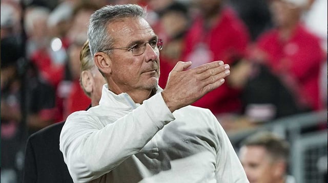 Former Ohio State Buckeyes head coach Urban Meyer salutes the fans chanting his name during the College Football Playoff quarterfinal against the Oregon Ducks at the Rose Bowl in Pasadena, Calif. on Jan. 1, 2025. Ohio State won 41-21.
