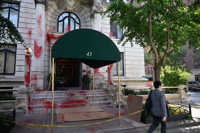 A view of red paint splattered across the front steps, walls, sidewalk and lamps outside the residence of New York Times Executive Editor Joe Kahn in Manhattan, New York, on Friday.