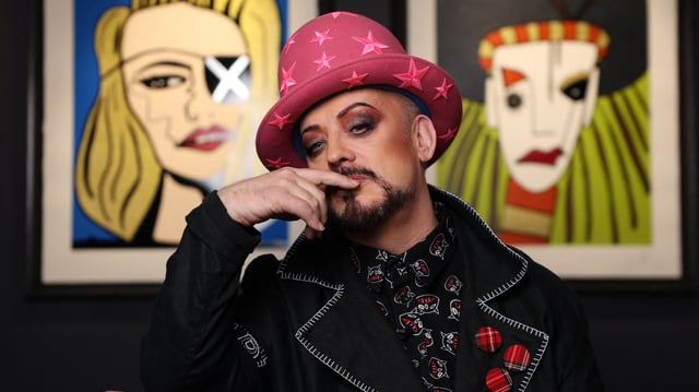 Boy George poses in front of his artworks at Castle Fine Art in London, Britain, October 23, 2024. REUTERS/Hollie Adams