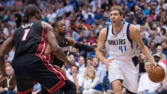 Feb 18, 2014; Dallas, TX, USA; Miami Heat center Chris Bosh (1) and shooting guard Dwyane Wade (3) guard Dallas Mavericks power forward Dirk Nowitzki (41) during the first quarter at the American Airlines Center. Mandatory Credit: Jerome Miron-Imagn Images