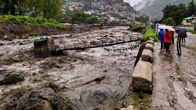 Sarvari river in spate after a cloudburst, in Kullu district, Himachal Pradesh, on August 19, 2025. 