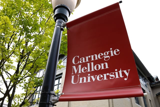 FILE - A Carnegie Mellon University sign is displayed outside Baker Hall on the university's campus in Pittsburgh, June 7, 2019. (AP Photo/Gene J. Puskar, File)