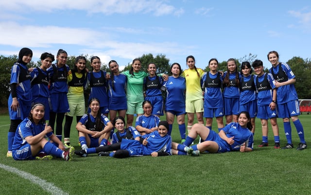 Soccer Football - Members of the Afghan Women's Refugee team pose for a team group during a selection camp at St. George's Park, Burton upon Trent, Britain - August 26, 2025 REUTERS/John Sibley