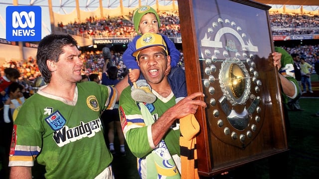 Noa Nadruku holds the JJ Giltinan Shield after winning the 1989 NSWRL grand final.